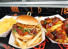 a photo of cheese fries burnt end sandwich and piggy fries