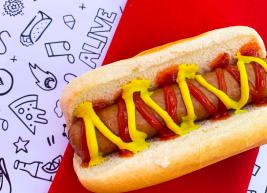 a photo of a hot dog with ketchup and mustard